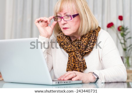 Woman concentrated working with her computer