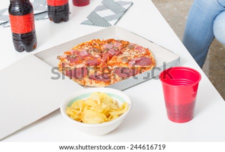 Pizza dinner. Box with pizza and cola plastic cup and bottle