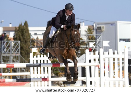 OLIVA, SPAIN - MARCH 10:  An unidentified competitor jumps with his horse at the MET Mediterranean Equestrian Tour on March 10, 2012, Oliva, Spain