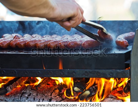 grill, sausages being prepared on fire; barbeque