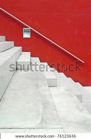 white stairs against bright red wall
