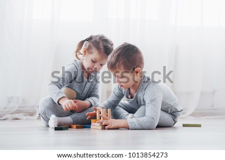 Similar – Image, Stock Photo Two brothers playing with pillows at home.