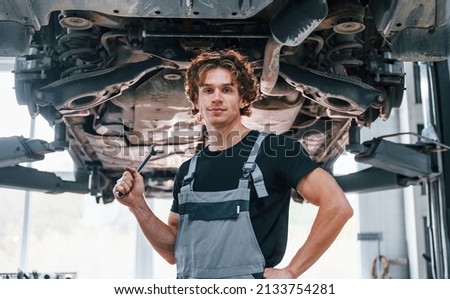 Similar – Image, Stock Photo young male mechanic works in his home workshop