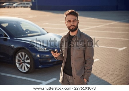 Similar – Image, Stock Photo Stylish man standing near wall