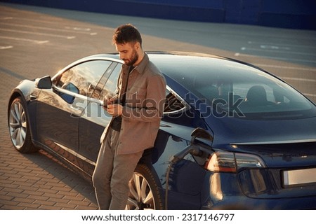 Similar – Image, Stock Photo Stylish man standing near wall