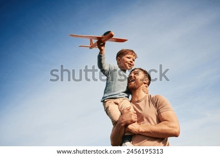 Similar – Image, Stock Photo Happy family on a camping trip relaxing in the autumn forest. Camper trailer. Fall season outdoors trip