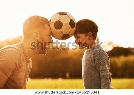 Similar – Image, Stock Photo Father with sons and ball