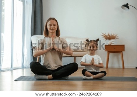 Similar – Image, Stock Photo Two beautiful sisters do their homework during quarantine. Children use gadgets for learning. Education, distance learning, home schooling during quarantine