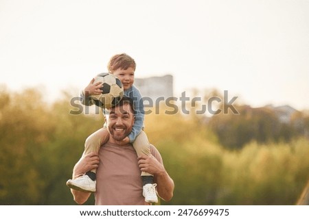 Similar – Image, Stock Photo Father with sons and ball