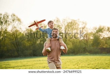 Similar – Image, Stock Photo Child playing with father through window