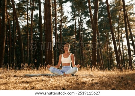 Similar – Image, Stock Photo Woman doing yoga in Supported Headstand pose