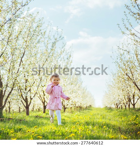 child running outdoors blossom trees. Art processing and retouching photos special.