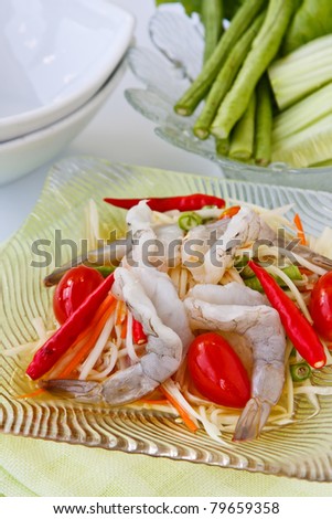 Thai food, green papaya salad  with rare shrimp sour and spicy coconut milk dressing.