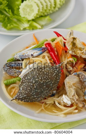 Thai popular dishes, spicy papaya salad with raw blue crab