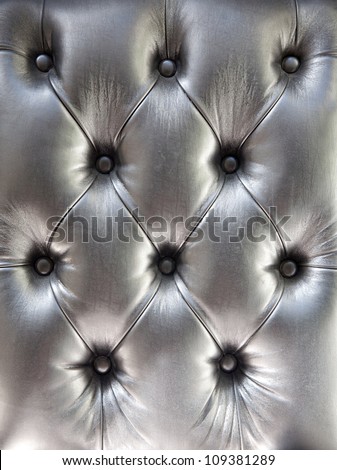 black genuine leather upholstery/silver genuine leather background