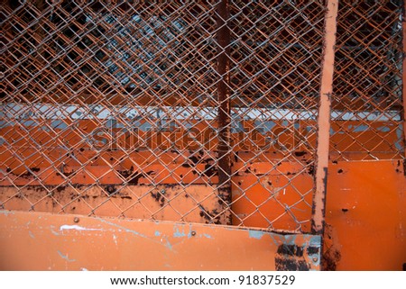 iron fence Rusty old corrugated iron fence close up.