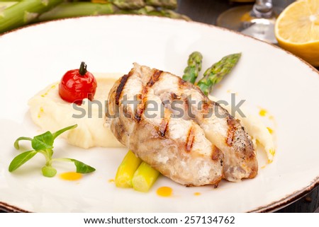 Sturgeon steak with mashed potatoes