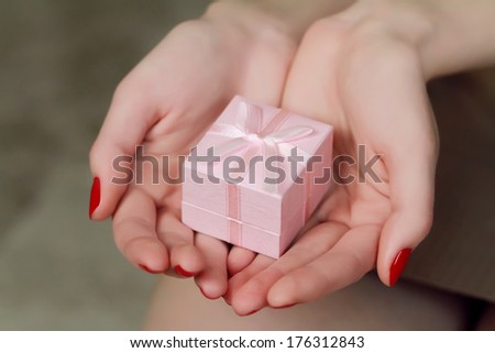 woman holding a ring box