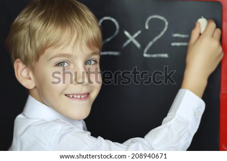 boy solves a mathematical task