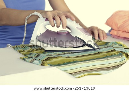 woman irons clothes