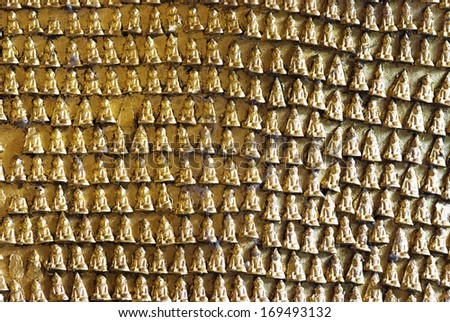 Small gilded Buddha images engraved on the Pindaya caves' wall