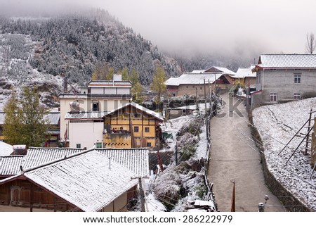 Snow-covered village in Chuanzhusi Town, Sichuan, China