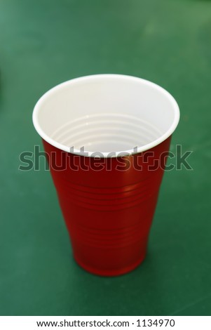 Red plastic cup on a picnic table