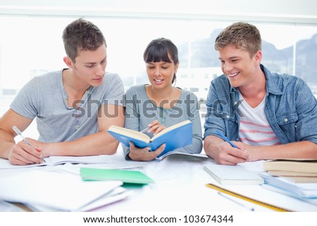 A pair of male students as the female student for help with work