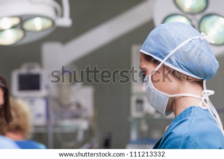 Nurse wearing a mask in operating theater