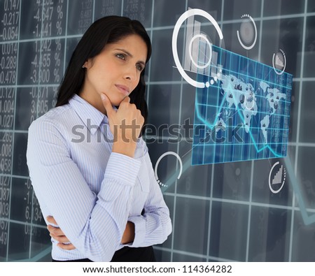 Woman standing thinking arms crossed looking at world map hologram
