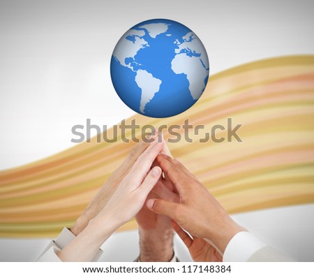 People reaching hands up to a globe against white background with orange wave