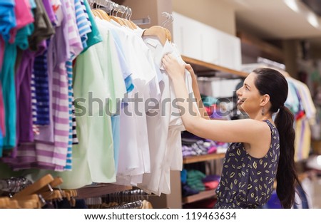Woman sorting clothes at a boutique