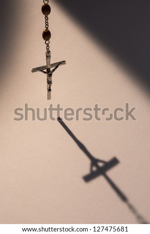 Similar – Image, Stock Photo A rosary hangs from an open Christian prayer book with the Our Father