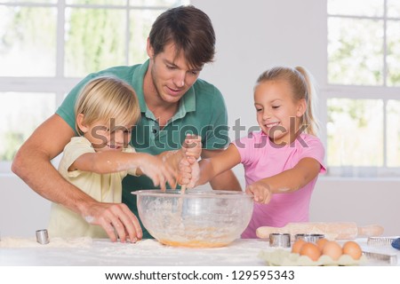 Similar – Image, Stock Photo Cheerful siblings mixing dough together in kitchen