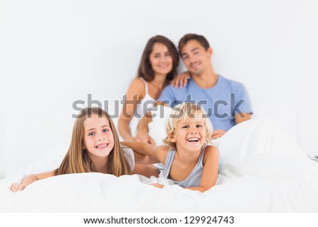 Offspring lying on the bed in the bedroom