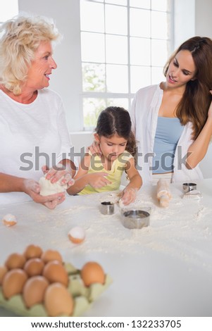 Women of a family baking together in the kitchen