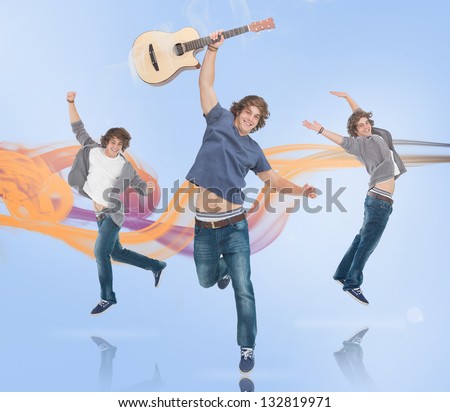 Three of the same young man jumping for joy one holding a guitar with orange and purple smoke trail on blue background