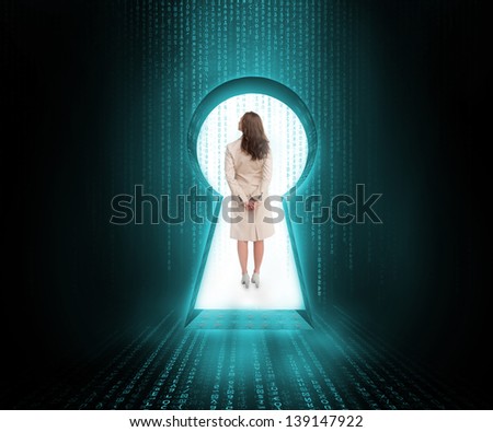 Businesswoman standing in keyhole door in blue and black matrix
