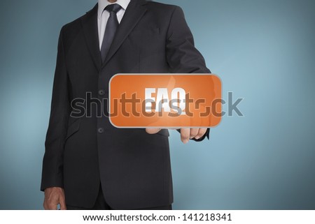 Businessman selecting orange tag with the word faq written on it on blue background