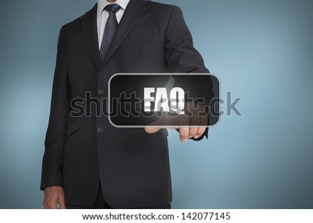 Businessman touching the word faq on blue background