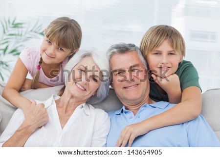Grandchildren with their grandparents in living room