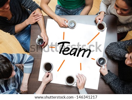 Team at work drinking coffee with team text on white panel