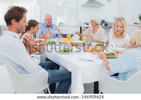 Extended family at the dinner table in kitchen