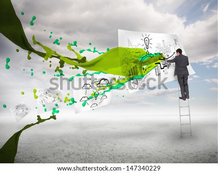 Businessman drawing on a paper next to green paint splash with blue sky on the background