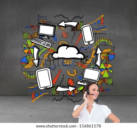 Composite image of cheerful smart call center agent working in front of economic illustrations in grey room
