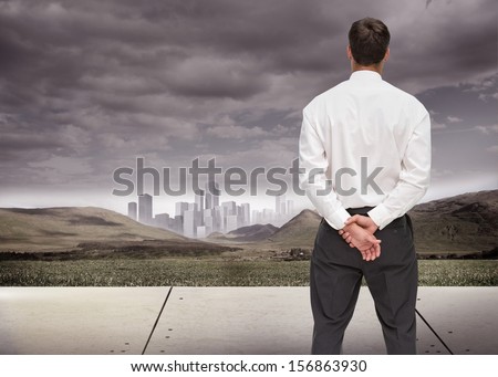 Composite image of businessman turning his back to camera looking at distance city