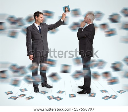 Classy businessmen working together holding profile picture