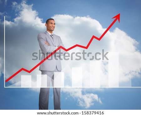 Content businessman standing behind graphics in grey suit