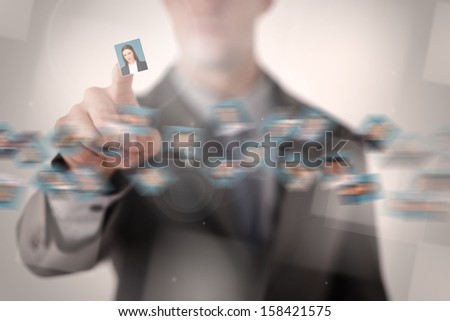Businessman picking profile picture from pictures whirl