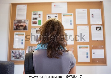 Student studying notice board in school Foto d'archivio © 